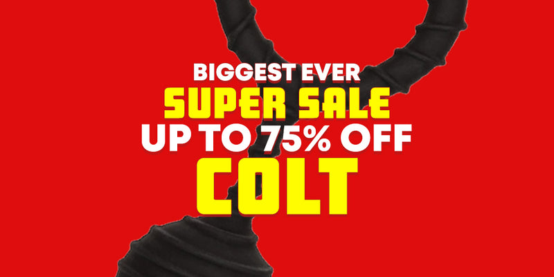 Promotional sale graphic with a bright red background, bold yellow and white text reading 'BIGGEST EVER SUPER SALE UP TO 75% OFF COLT,' and a black sex toy weighted ball stretcher