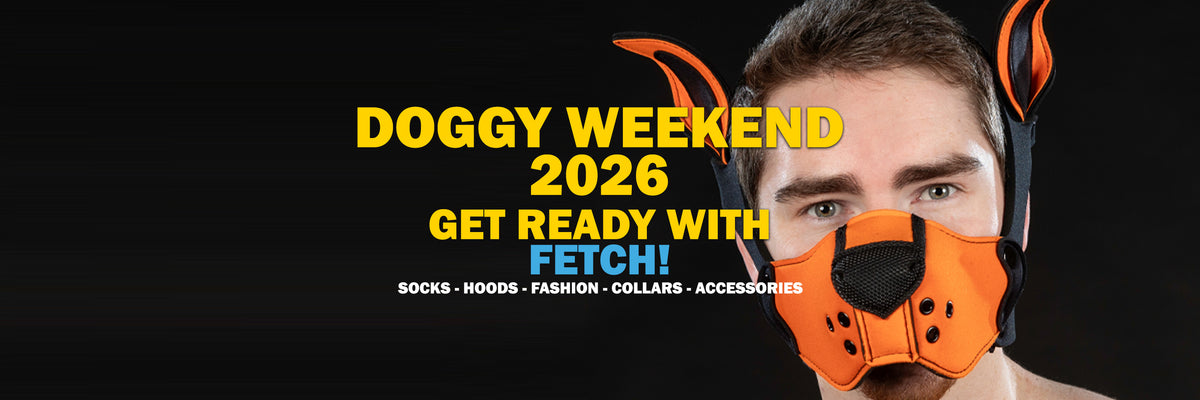 A man wearing an orange and black dog harness with attached pointed ears, shown against a black background with large yellow text reading 'DOGGY WEEKEND 2026 GET READY WITH FETCH!' and smaller text listing socks, hoods, fashion, collars, and accessories.