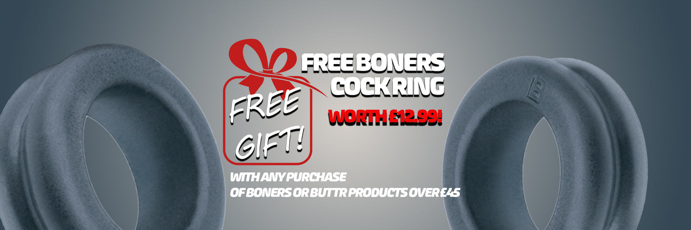 Two gray rings with promotional text for a free boners cockring on a dark background