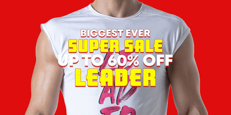 A cropped studio-style shot of a muscular person wearing a white sleeveless t-shirt against a bright red background, with large promotional text overlaid reading 'BIGGEST EVER SUPER SALE UP TO 60% OFF LEADER' in yellow and white.