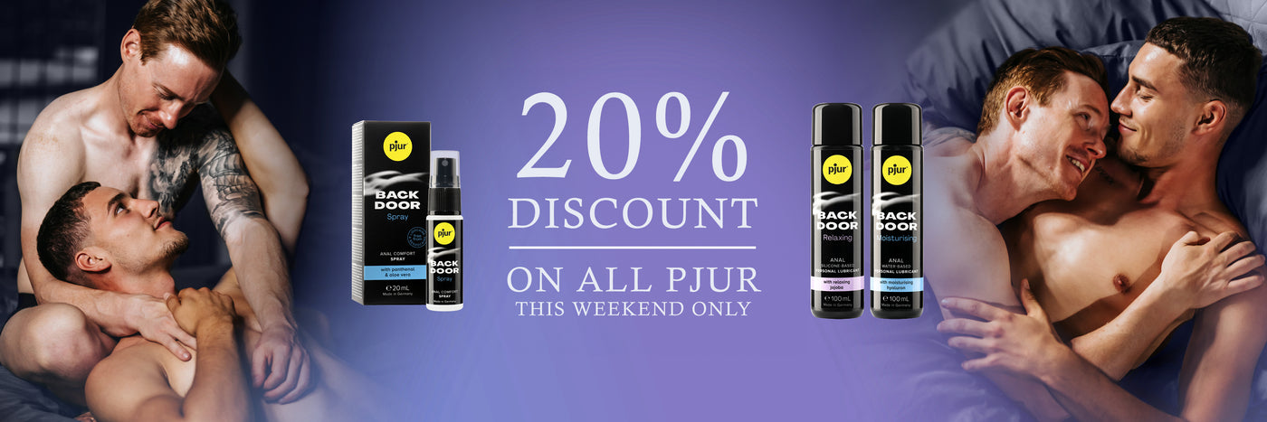 Promotional banner with two men embracing, Pjur products, and a discount offer on a purple background.