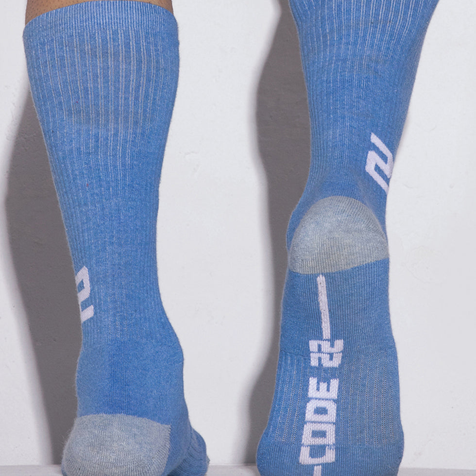 Blue socks with a brand logo on a white background
