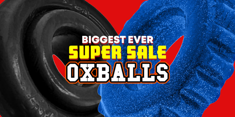 Promotional graphic for 'Biggest Ever Super Sale OXBALLS' featuring a black tire on the left and a blue textured OXBALL product on the right, with bold yellow and white text over a red background.